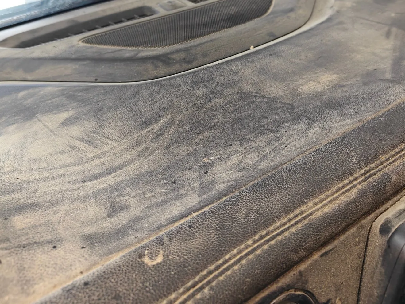 Dashboard caked in dust and grime before detailing