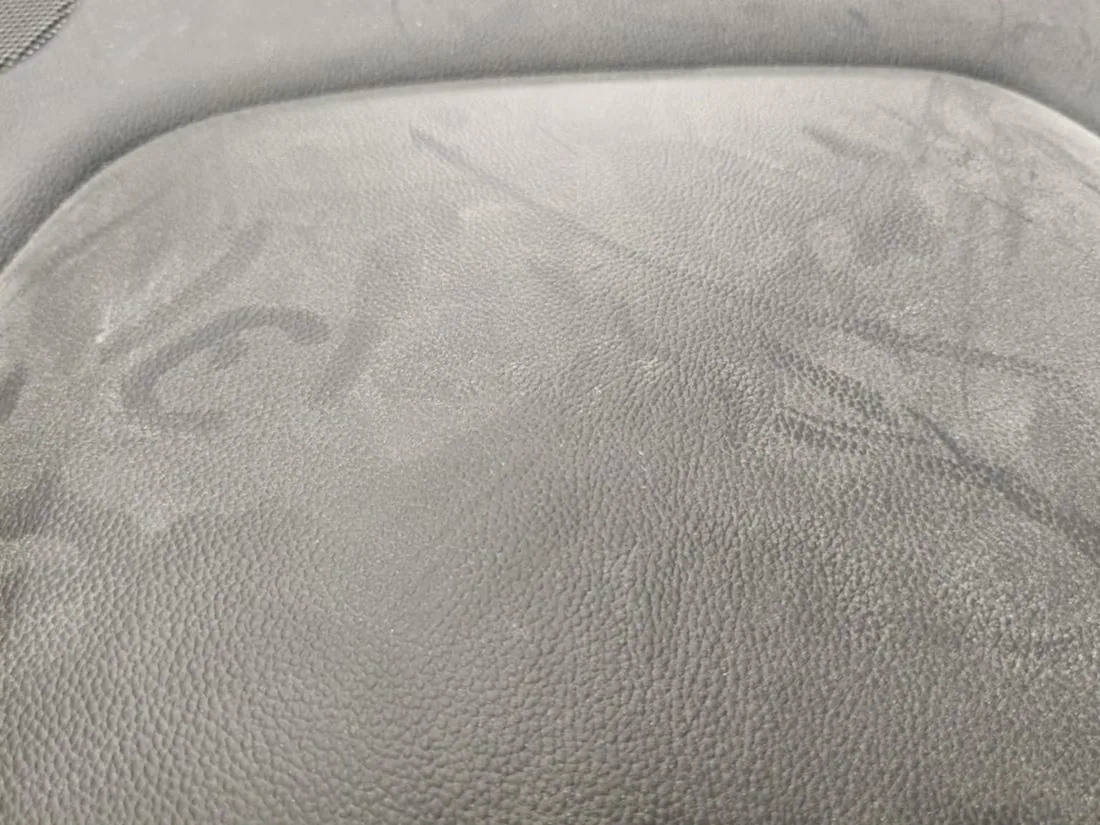 Heavily stained vehicle seat before deep shampoo and extraction