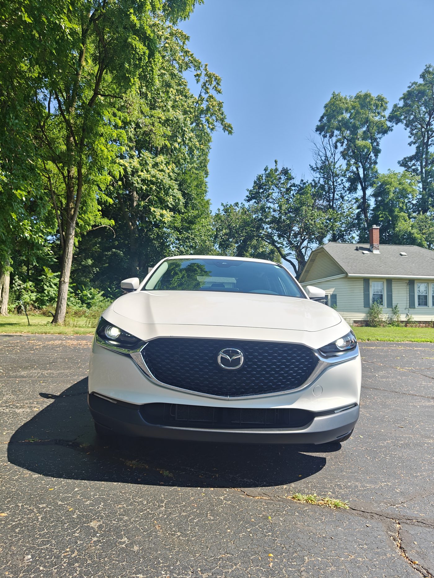White Mazda sedan front end detailed and shining