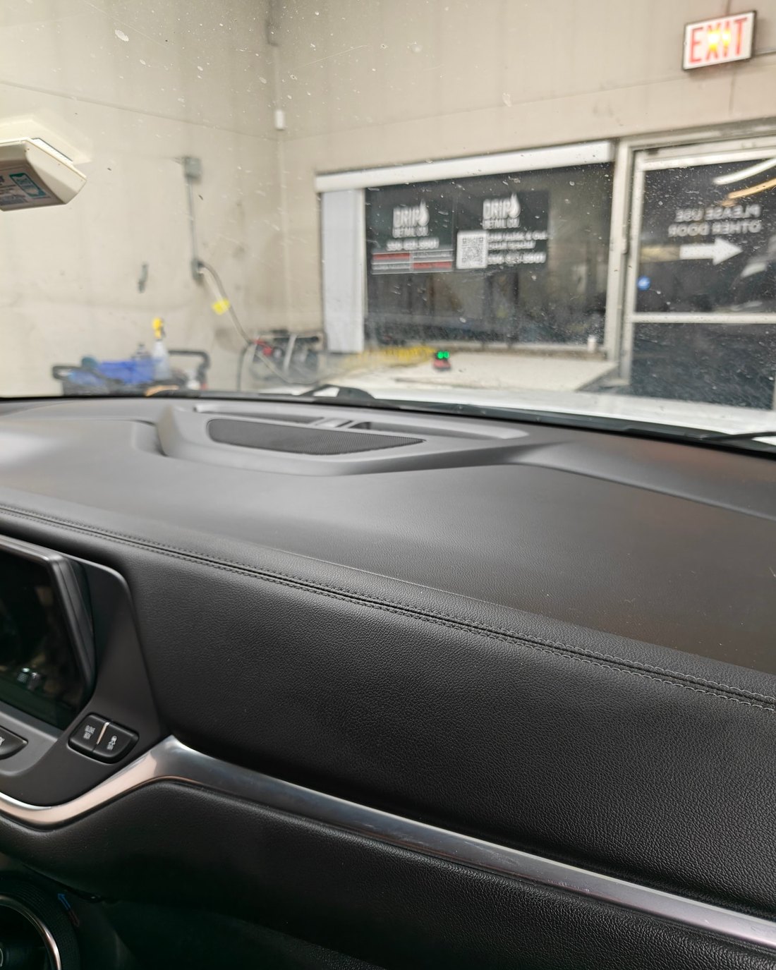 Spotless black Subaru dashboard after a full interior detail